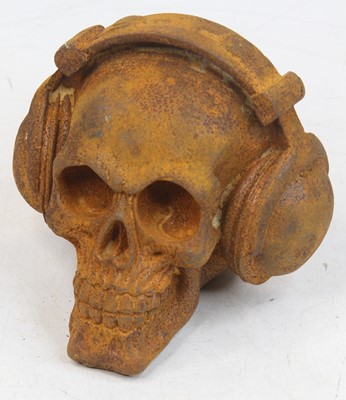 Lot 531 - A rusted metal model of a skull wearing...