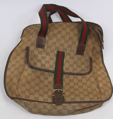 Lot 559 - After Gucci, a monogrammed canvas tote bag,...