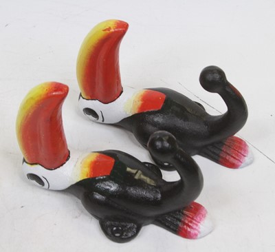 Lot 563 - A pair of painted metal coat hooks, each in...