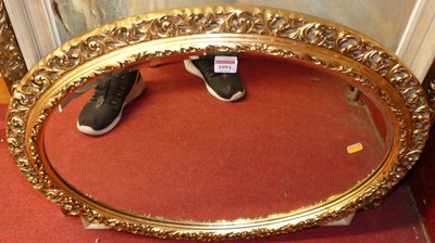 Lot 1094 - A modern gilt framed oval wall mirror, 70cm,...