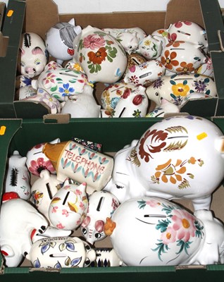 Lot 594 - A collection of floral decorated pottery piggy...