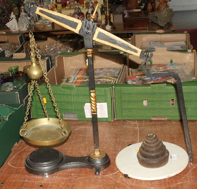 Lot 618 - A 19th century cast iron and brass balance...