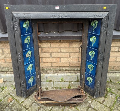 Lot 1388 - An Edwardian cast iron and tiled fire insert,...