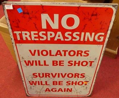 Lot 1127 - A lithograph printed tin sign 'No Trespassing',...