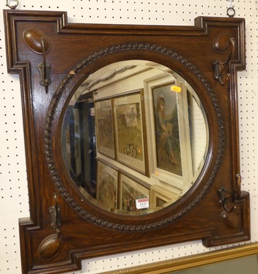 Lot 1137 - An oak framed and bevelled hall mirror, w.61cm