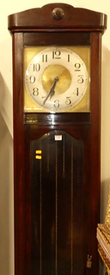 Lot 1188 - A 1920s stained beechwood longcase clock,...