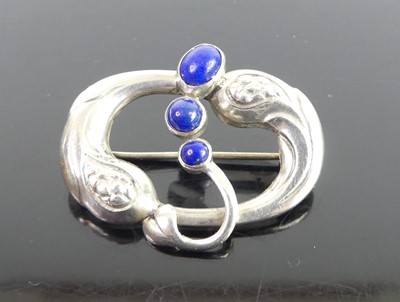 Lot 90 - Georg Jensen - a stylised silver and lapis...