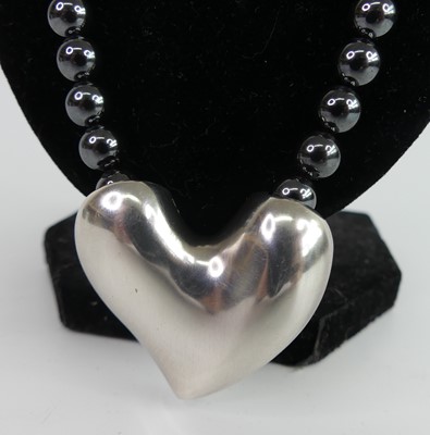 Lot 96 - Georg Jensen - a sterling silver heart shaped...