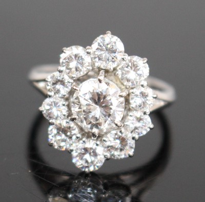 Lot 2266 - A white metal diamond oval cluster ring,...