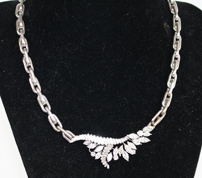 Lot 2264 - A white metal diamond necklace, featuring a...