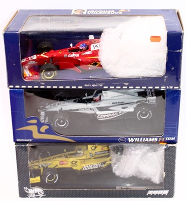 Lot 1010 - A Minichamps and Hotwheels group of three...