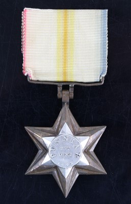 Lot 3033 - A Gwalior Star in bronze, the central silver...