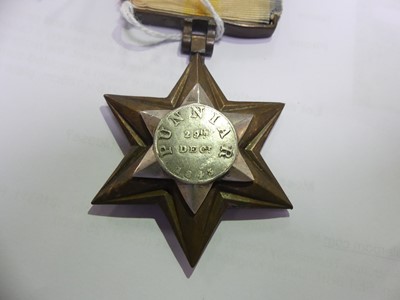 Lot 3033 - A Gwalior Star in bronze, the central silver...