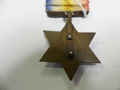 Lot 3033 - A Gwalior Star in bronze, the central silver...
