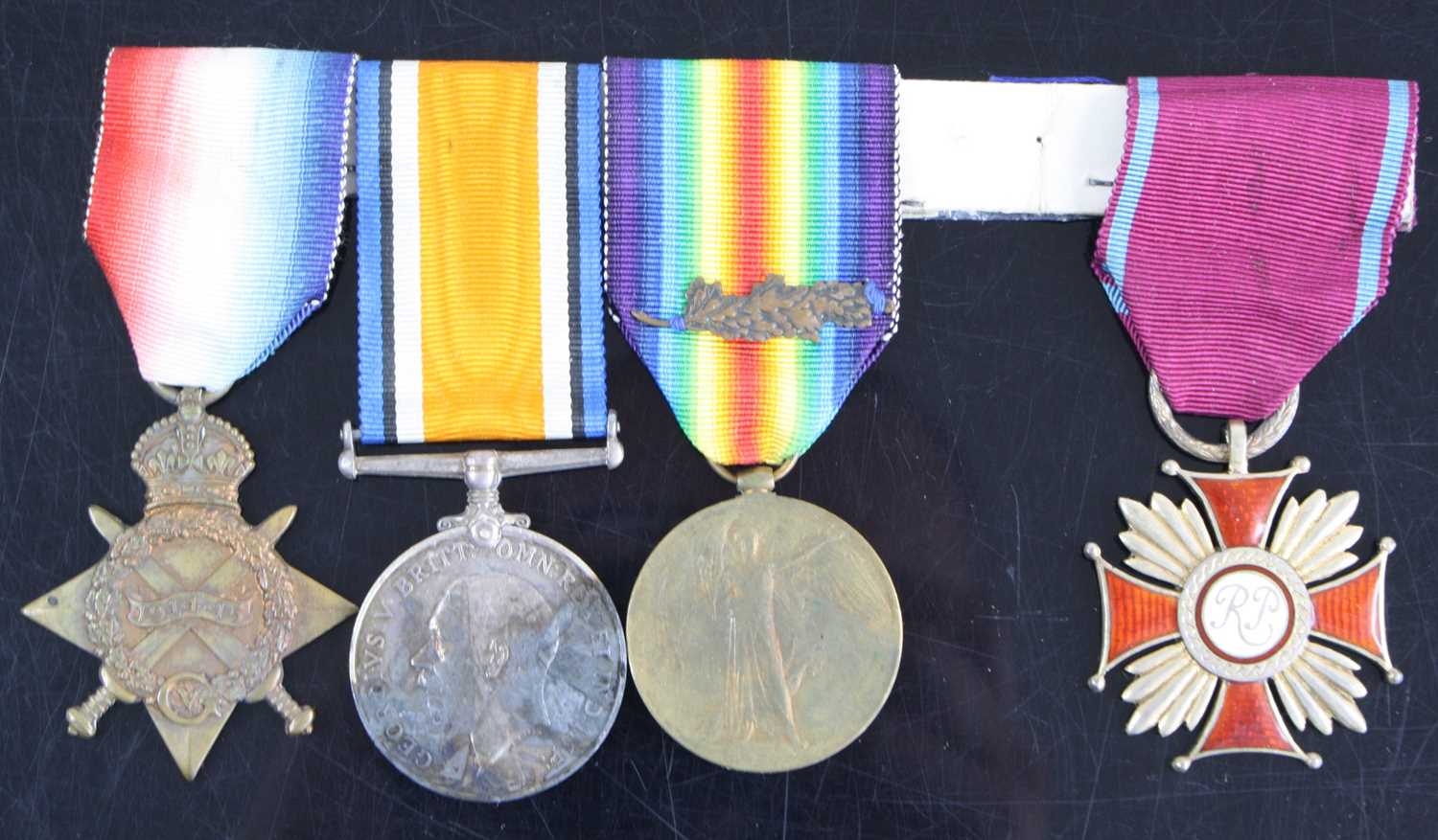 Lot 3061 - A group of four medals to include WW I 1914-15...