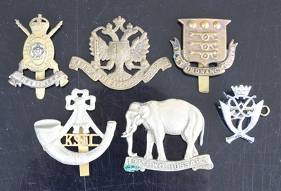 Lot 3084 - A collection of cap badges and insignia to...