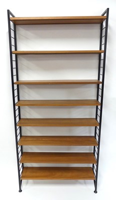 Lot 373 - A 1970s Ladderax teak and black painted metal...