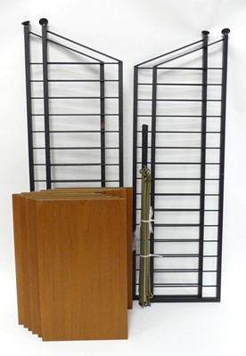 Lot 374 - A 1970s Ladderax teak and black painted metal...