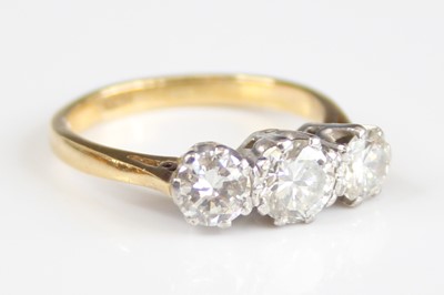 Lot 2246 - An 18ct gold diamond three-stone ring,...