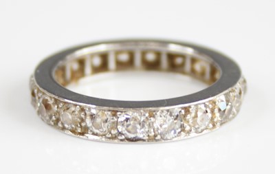 Lot 2228 - A white metal diamond eternity ring, having 19...