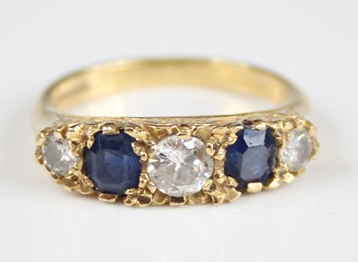 Lot 2281 - An 18ct yellow gold, sapphire and diamond half...