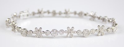 Lot 2230 - A white metal diamond line bracelet,...