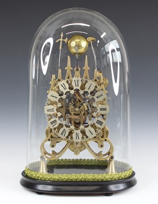 Lot 2450 - A brass triple fusee skeleton clock, under...