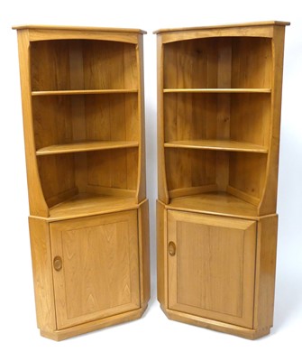 Lot 1137 - A pair of contemporary Ercol blond elm 'Model...