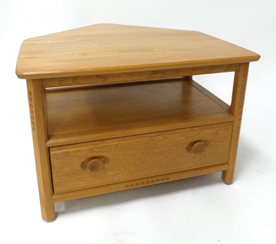 Lot 398 - A contemporary Ercol blond elm 'Model 1130'...