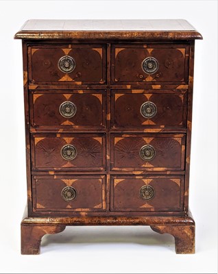 Lot 2517 - An oyster veneered miniature chest in the...