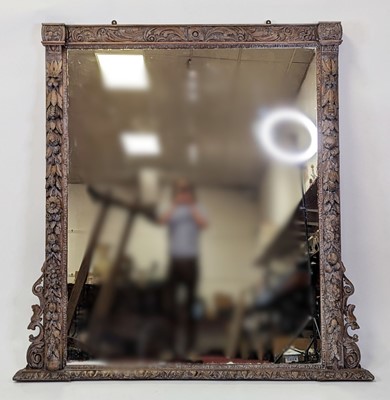 Lot 2475 - A Victorian carved limed oak overmantel mirror,...