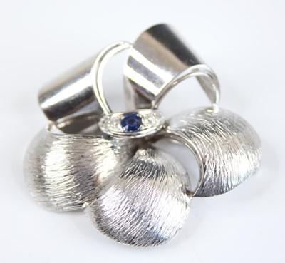 Lot 2209 - A contemporary 18ct white gold, sapphire and...