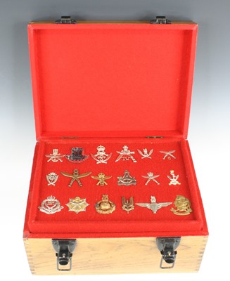 Lot 3203 - A large collection of cap badges, to include...