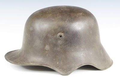 Lot 3220 - A German model 1918 steel helmet, with ear cut...