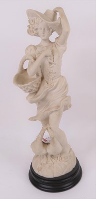 Lot 36 - A 20th century white pottery figure of a young...