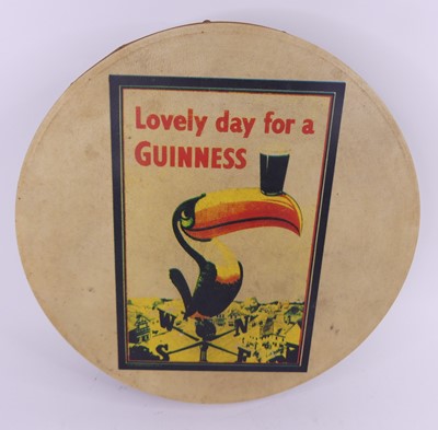 Lot 92 - A vintage Guinness advertising drum, dia. 46cm