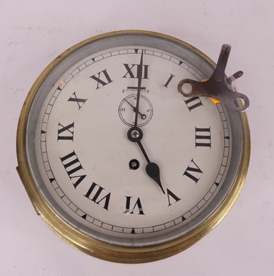 Lot 124 - A vintage brass ship's clock, the dial showing...