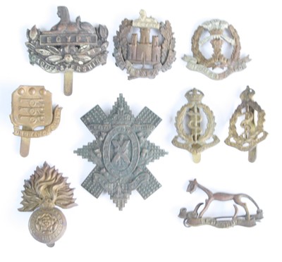 Lot 3198 - A collection of cap badges and insignia to...