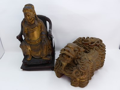 Lot 193 - A Chinese carved giltwood figure of a...