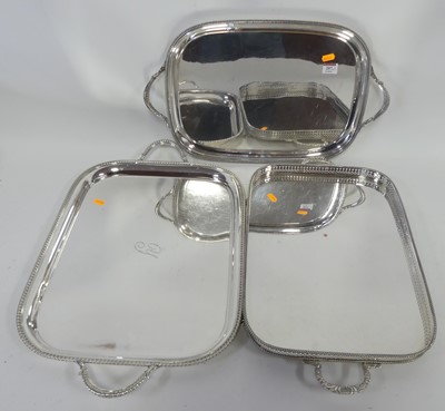 Lot 207 - A graduated set of two silver plated serving...