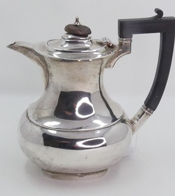 Lot 218 - A George V silver coffee pot, having an...