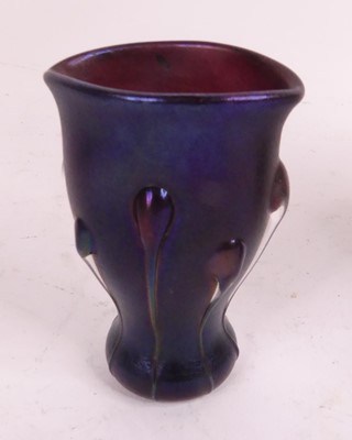 Lot 178 - An iridescent glass vase of elliptical waisted...