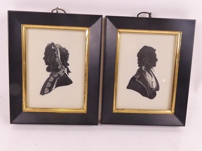 Lot 186 - A pair of reproduction silhouette portrait...