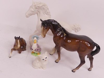 Lot 189 - A Beswick white matt glazed figure of a shire...