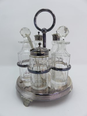 Lot 251 - A silver plated and glass table cruet set, h.22cm