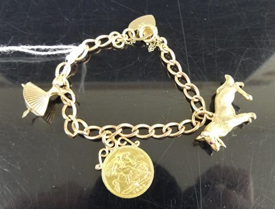 Lot 256 - A child's 9ct gold curblink charm bracelet,...