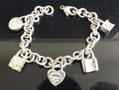 Lot 276 - A Tiffany & Co style white metal charm...