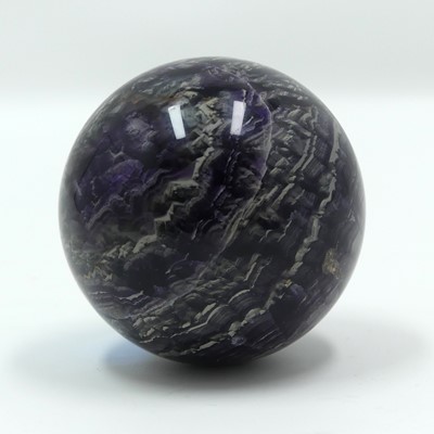 Lot 332 - A polished hardstone sphere, possibly...