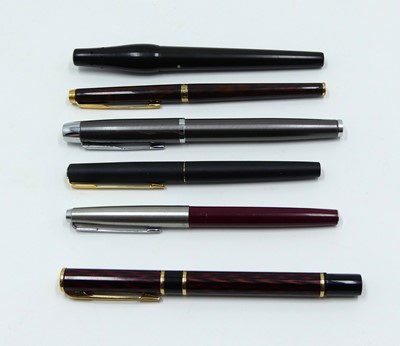 Lot 333 - A Waterman fountain pen, having red and black...