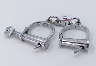 Lot 393 - A pair of antique style handcuffs